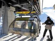 Friendly staff assist with boarding at the chairlift.