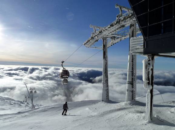 The mountain peak Chopok above the clouds