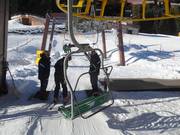 The staff assists at the chairlifts
