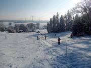 Ski lift and slope at Monte Kienader