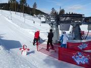 Children are assisted when getting on the lifts.