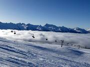 Sunshine on the mountain and fog in the valley
