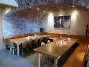 Large tables and vaulted brick ceilings in the Käsker