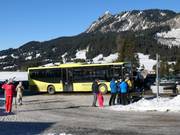 The village bus stops right at the slope.