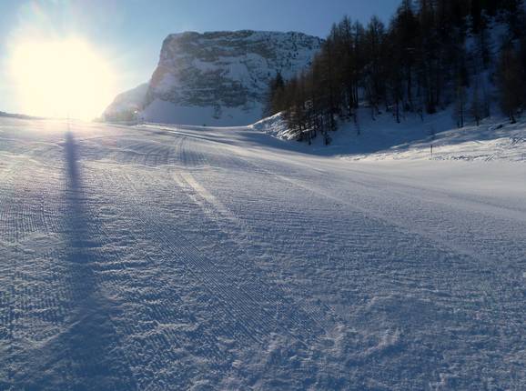 Freshly groomed slope in the morning