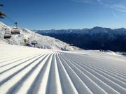 Perfect slope grooming in the Scuol ski area
