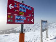 Slope signage with trail map in the ski area