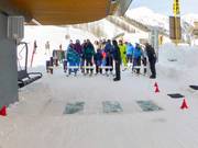 Assistance with boarding provided by two lift attendants