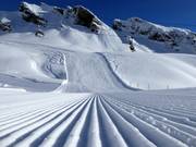Perfectly groomed slope in the First ski area