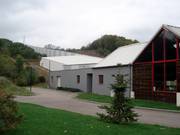 The ski hall nestles against the mountain