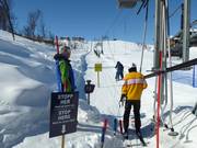 At the platter lift, staff monitor the boarding area.
