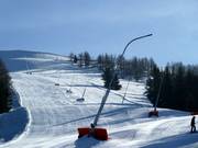Snow lances are almost always present along the slopes.