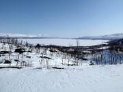 The lower part of the ski resort with a view of the 70 kilometre long Torneträsk lake