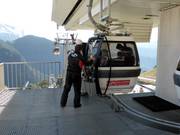 Skis are handed to guests at the gondola lift.