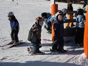 The little ones are already riding the lift on their own.