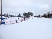 Gentle practice slope with conveyor belts