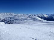 View over the ski area towards the Wildkogelbahn mountain station and the Hohe Tauern