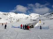 Gentle practice slopes with conveyor belts