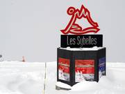 Stele at the junction of the ski areas that together form Les Sybelles