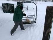 When it snows, the chairs are cleared of snow.