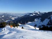 Schöngratbahn lift with a view of the Alps