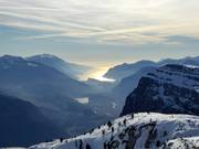 The view sweeps from the summit all the way to Lake Garda